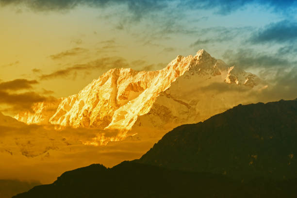 Nice last light from sunset on Mount Kanchenjugha, India Beautiful last light from sunset on Mount Kanchenjugha, Himalayan mountain range, Sikkim, India. color tint on the mountains at dusk kangchenjunga stock pictures, royalty-free photos & images