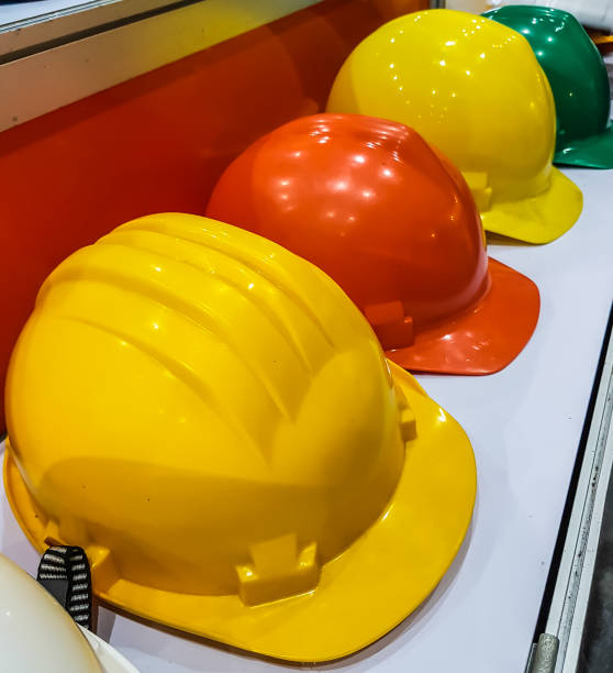 istock safety hat yellow and orange place on the table 820722122