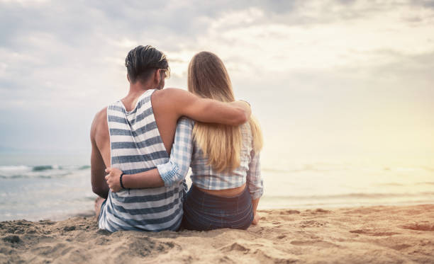 istock Happy couple date at the seaside at sunset 820723162