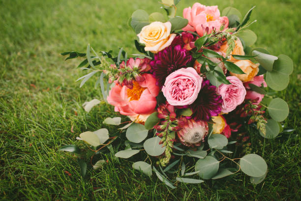 istock Pink and Purple Flower Bouquet on Grass 820729966