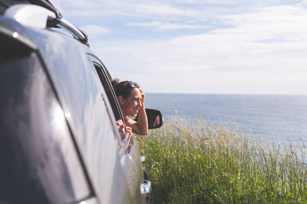 istock Group of friends inside car at viewpoint off Oregon Coast 820730984