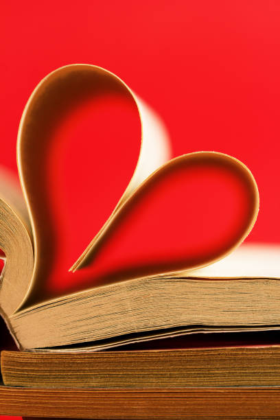 istock Romantic heart-shaped page book/Red background 820732288