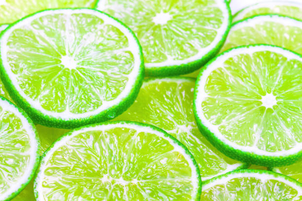 istock Green background with citrus-fruit of lime slices 820741264