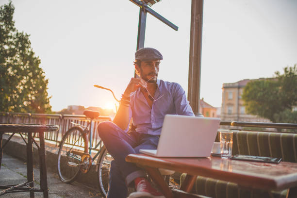 istock Man in cafe on laptop 820747428