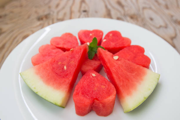 istock Watermelon on  white plate and wooden background. 820753500