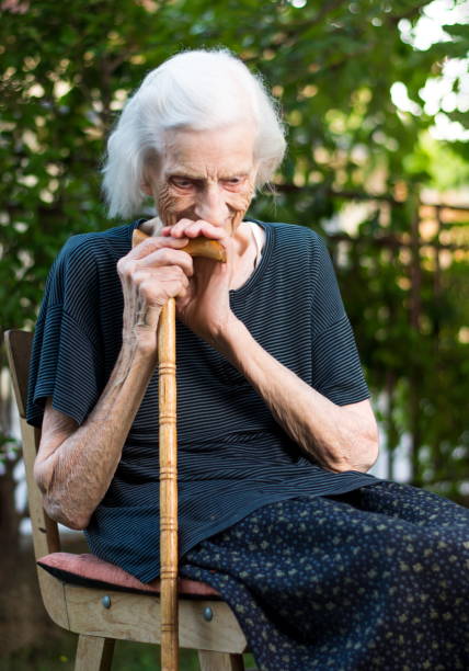 istock Cheerful senior woman with a walking cane 820753840