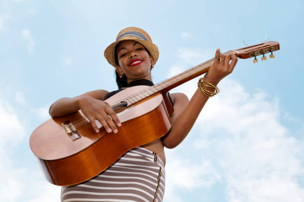 istock Cuban woman with guitar 820759346