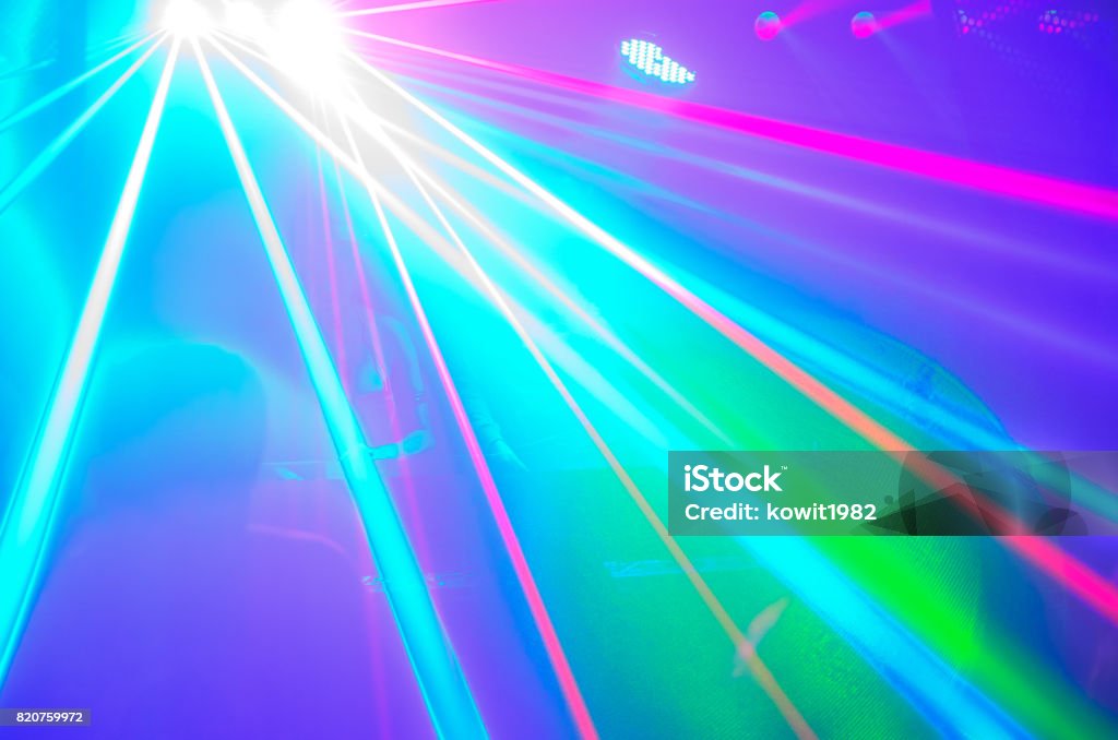 blur club party is blurred for background blur club party is blurred for background.Light in club party Show And Silhouette hands enjoying the club party with concert. Blurry night club DJ party people enjoy of music dancing sound . Abstract Stock Photo