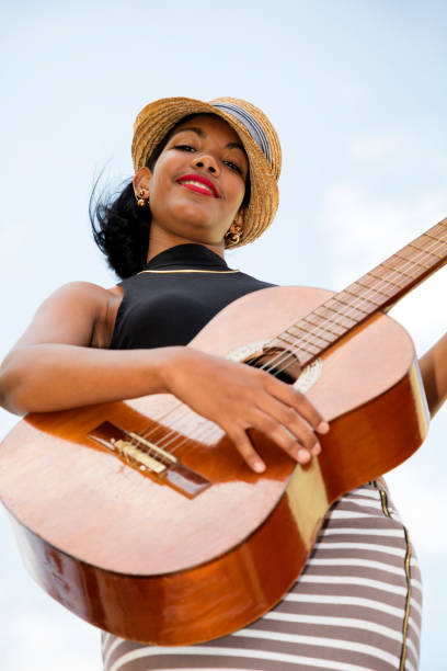 istock Cuban woman with guitar 820760146