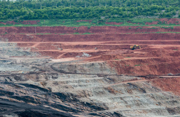 istock Part of a pit with big mining truck working 820763332