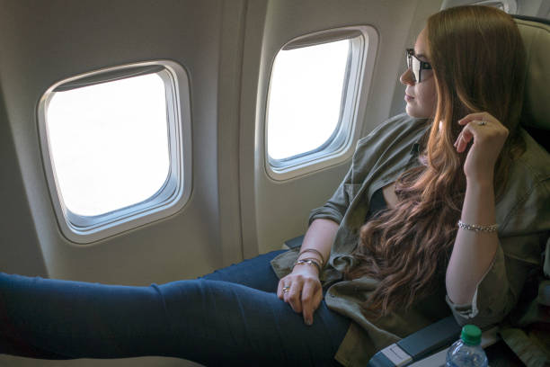 istock Woman relaxing on a flight 820766618
