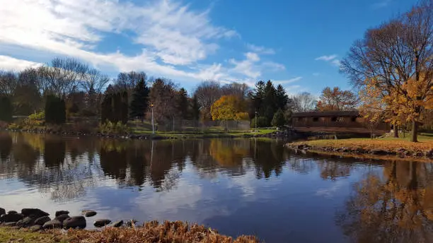 A scenic Autumn view of Fond du Lac's lakeside park over the water inlet from Lake Winnebago.