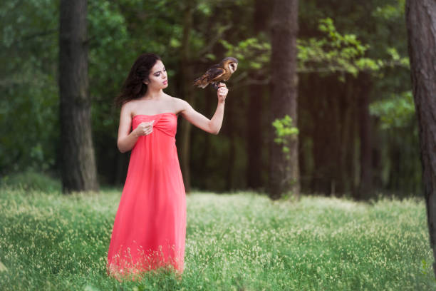 istock Beautiful woman with an owl. 820769536
