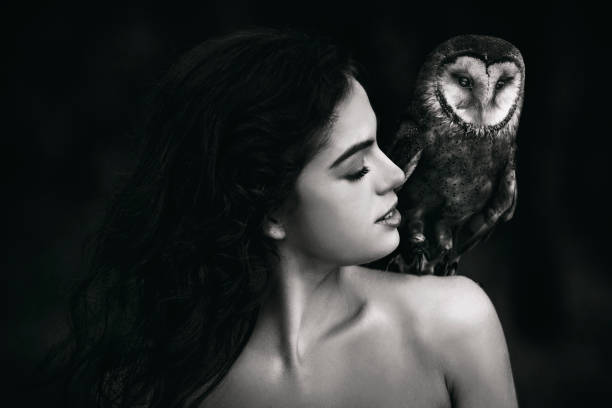 istock Beautiful woman with an owl. 820769612