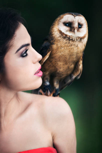 istock Beautiful woman with an owl. 820769692