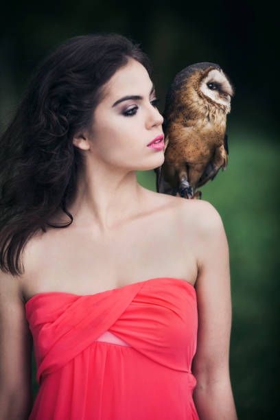 istock Beautiful woman with an owl. 820769700