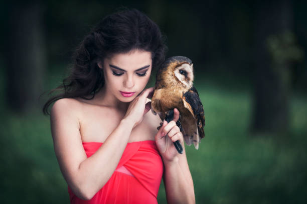 istock Beautiful woman with an owl. 820769872