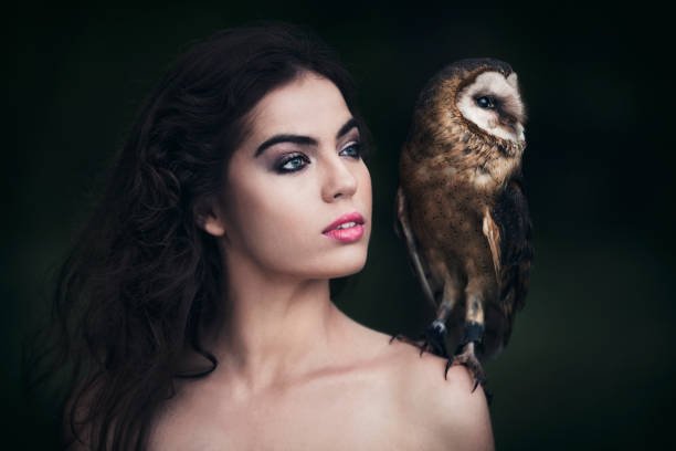 istock Beautiful woman with an owl. 820770022