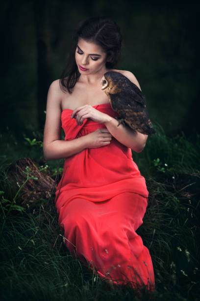 istock Beautiful woman with an owl. 820770104
