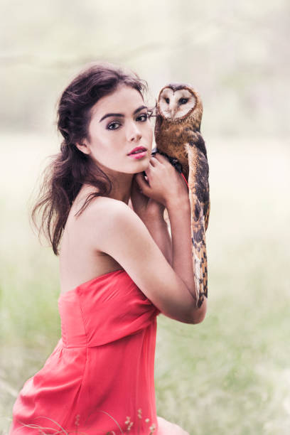 istock Beautiful woman with an owl. 820770156