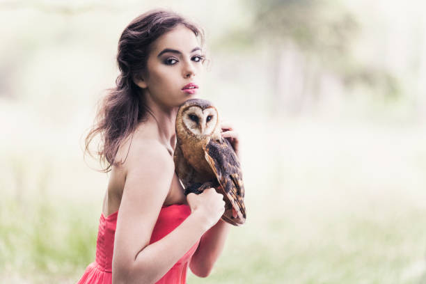 istock Beautiful woman with an owl. 820770316