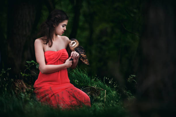 istock Beautiful woman with an owl. 820770368
