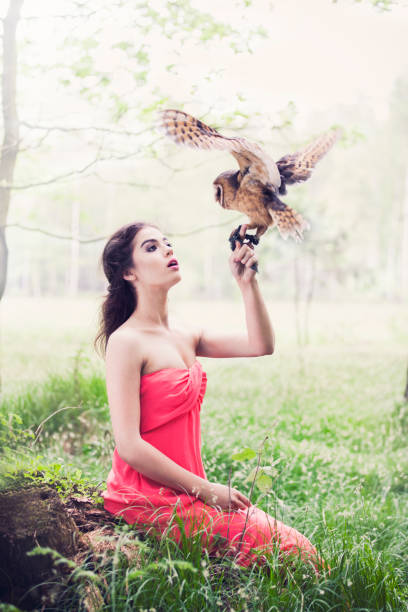 istock Beautiful woman with an owl. 820770550