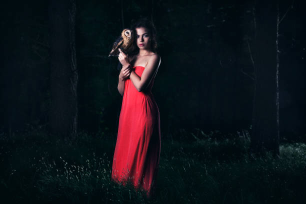 istock Beautiful woman with an owl. 820770622