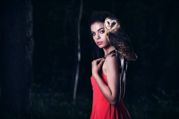 istock Beautiful woman with an owl. 820770698