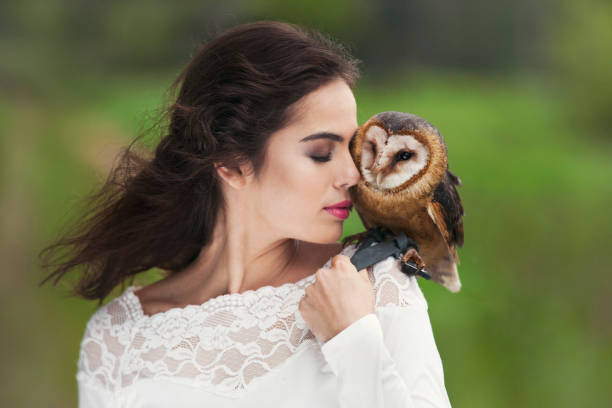 istock Beautiful woman with an owl. 820770826