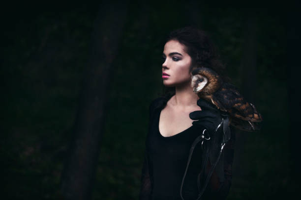 istock Beautiful woman with an owl. 820770996