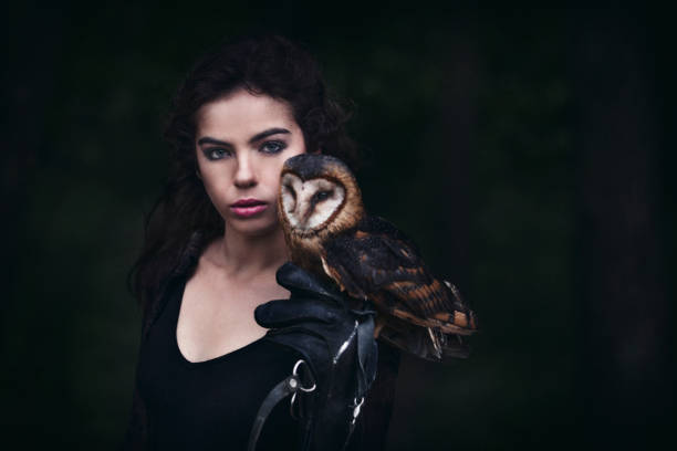 istock Beautiful woman with an owl. 820771004