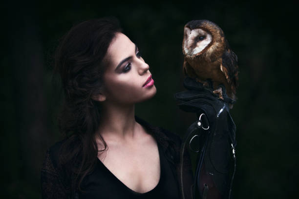 istock Beautiful woman with an owl. 820771016