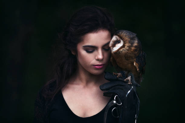 istock Beautiful woman with an owl. 820771034