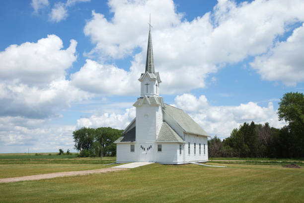istock Old white prairie church on sunny afternoon 820771452