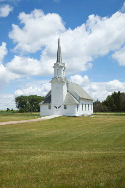 istock Old white prairie church on sunny afternoon 820771466