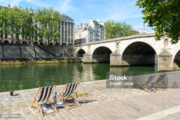 Deck Chairs In The Sun On The Bank Of The River Seine Stock Photo - Download Image Now