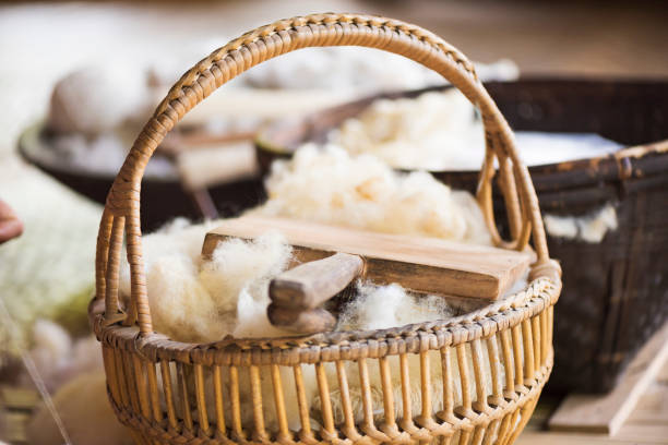 Raw sheep wool in the basket.