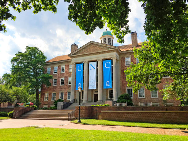 The South Building At University Of North Carolina at Chapel Hill The South Building at The University of North Carolina at Chapel Hill in Chapel Hill, North Carolina is adorned with banners on a beautiful spring day. university of north carolina photos stock pictures, royalty-free photos & images