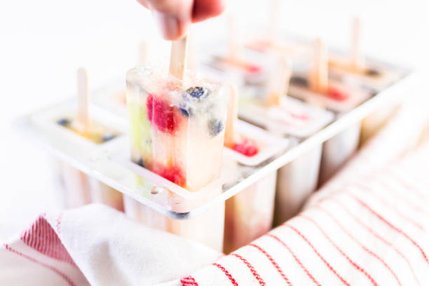 istock Making homemade fresh fruit popsicles with apple juice 820780774