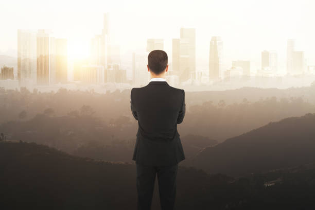 istock Man looking at brown landscape 820781262