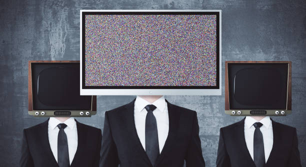 istock Obsolete and modern TV headed businessmen 820781318