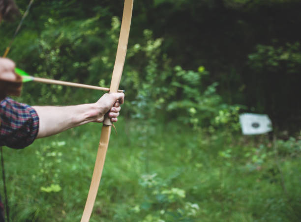 istock Archer nocking an arrow to bow and aiming. Traditional archery 820782958