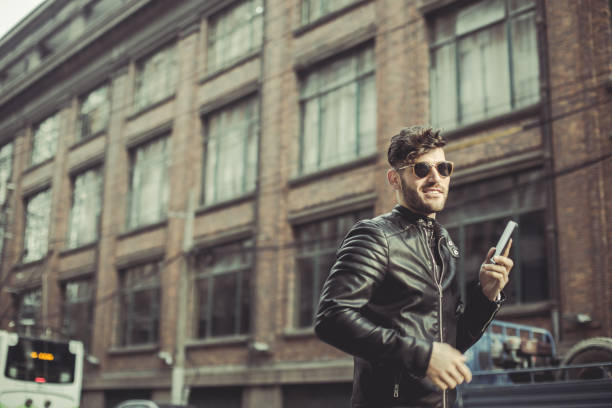 istock Talking on the phone in the street 820783168