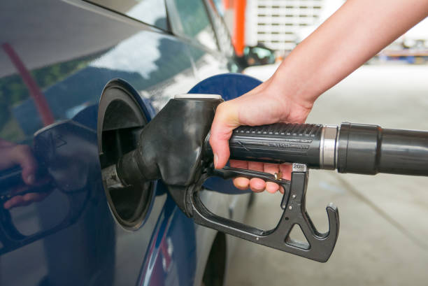 istock Woman's hand filling the car with diesel engine 820784574