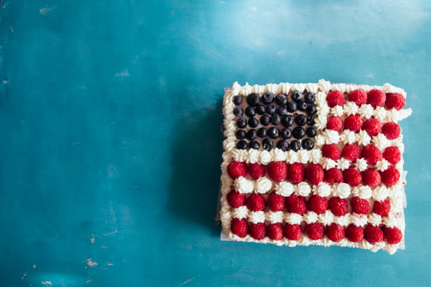 istock Cake topped with berries to make an American flag 820786224