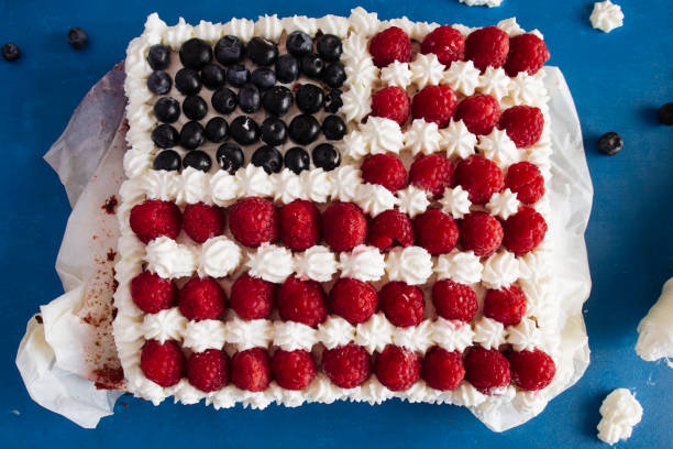 istock Cake topped with berries to make an American flag 820786228