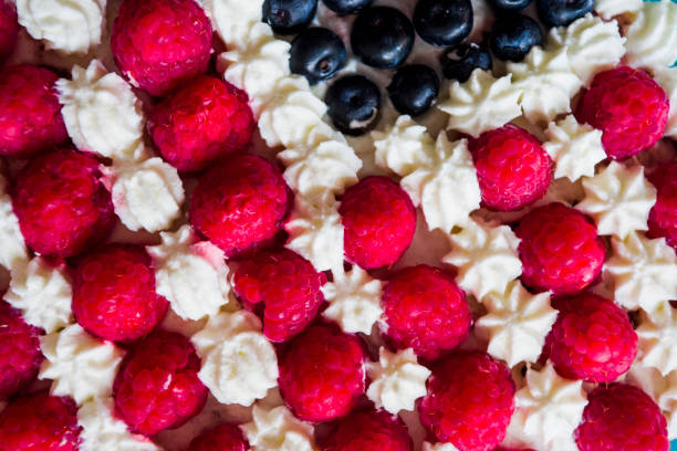 istock Cake topped with berries to make an American flag 820786244