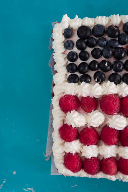 istock Cake topped with berries to make an American flag 820786288