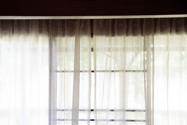 istock White curtain  at the door background 820806976